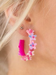 These earrings add a playful, summer inspired touch to any look. The thread wrapped hoop features floral details throughout the silhouette to add a bold touch to your summer look. Spring Jewelry With 3d Flowers, Trendy Hoop Earrings For Summer Beach, Pink Hoop Earrings For The Beach, Pink Earrings With Handmade Flowers For Spring, Handmade Hoop Earrings For Summer Vacation, Pink Handmade Flower Earrings For Spring, Spring Pink Earrings With Handmade Flowers, Trendy Hoop Earrings For Spring Beach Events, Trendy Hoop Earrings For Beach In Spring