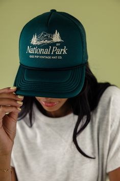 Designed for adventure, the National Park Trucker Hat has got a comfy adjustable snap-back strap and cool mesh for breezy wear. Choose from earthy shades and sport a retro national park graphic. Perfect for exploring the outdoors!! 100% polyester adjustable strap curved brim medium crown height medium stiffness Vintage 5-panel Hat For Outdoor Activities, Retro Baseball Cap For Outdoor, Retro Outdoor Hat With Snapback, Retro Outdoor Baseball Cap, Retro Outdoor Snapback Hat, Summer Baseball Cap For Outdoor Activities, Vintage Curved Brim Hat For Outdoor Activities, Green 5-panel Hat For Travel, Vintage Snapback Hat For Outdoor Activities