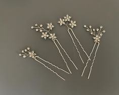 Delicate sparkly Hair Pin Set!  These gorgeous crystal hand hair pins  can be styled so many ways in your hair and will had the perfect touch of shimmer for your wedding hairstyle. READY TO SHIP DETAILS * Sold in set of 4 * Pins measures aprox .34" wide by .25" tall to .34" wide by 1.5" tall * Offered in  Silver  * Versatile & flexible with hardwired branches,  this hair pin can be styled as a single pin or in multiples as     a hair vine. COMPLETE COLLECTION: https://www.etsy.com/shop/AGoddessD Wedding Hair Pin, Sparkly Hair, Flower Hair Pins, Crystal Hair Pins, Wedding Hair Pins, Flower Hair Pin, Bridal Hair Pins, Hair Vine, Crystal Hair