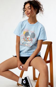 Online only! Who knew that dressing "mousey" could be so cute? Celebrate Walt Disney's most iconic character with these officially licensed Mickey Mouse and Friends styles! All of your favorites, like Mickey Mouse, Minnie Mouse, Goofy, Pluto, Donald Duck, and more, are featured across these adorable Mickey designs that are perfect for your next trip to Disneyland! The Beach Mickey Mouse T-Shirt features a crew neckline, short sleeves, and a front graphic for that classic look.&nbs Disney Crew Neck T-shirt For Summer, Mickey Mouse Tops For Disney Trips In Summer, Casual Tops For Disney Trips In Summer, Casual Tops For Summer Disney Trips, Casual Summer Tops For Disney Trips, Casual T-shirt For Disney Fan Events In Summer, Disney T-shirt For Summer Fan Events, Character Print Tops For Disney Fan Events In Summer, Character Print Tops For Summer Disney Fan Events