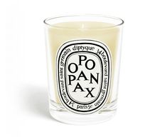 a candle that is sitting in front of a white background with the words chne on it