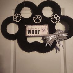 a mickey mouse door hanger that says you had me at woof