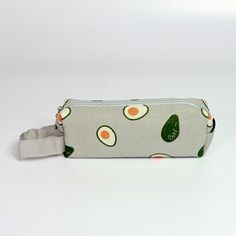 HST01258: Avocado Print Pencil Case Make learning fun with our fabric Avocado print pencil case! Stuff it with pencils, or pens, or turn it into an adorable make up bag! Fabric Pencil Case, Avocado Print Stocking Stuffer under $10 Color, grey/tan 8" X 3" X 1.5" *Please Bear in Mind That Photo May Vary Slightly From Actual Item. Casual Pencil Case With Pen Holders, Casual Pencil-shaped Pencil Case For Daily Use, Casual Pencil Case For Daily Use, Trendy Green Pencil Case For School, Casual Back To School Pencil Case With Pen Slots, Portable Green Pencil Shaped Pencil Case, Portable Green Pencil-shaped Pencil Case, Green Pencil Shaped Case With Pen Slots, Green Pencil-shaped Case With Pen Slots