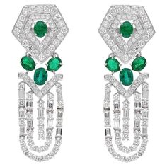 These exquisite earrings are handcrafted in 18-karat gold, 2.27 carats emerald and set in 3.99 carats of sparkling diamonds. FOLLOW MEGHNA JEWELS storefront to view the latest collection & exclusive pieces. Meghna Jewels is proudly rated as a Top Seller on 1stDibs with 5 star customer reviews. All items manufactured by us are handmade and can be customized or redesigned. Certificate available upon request. Composition Gross Weight : 13.04 Gms. Gold Net Weight : 11.79 Gms. Emerald Weight: 2.27 ct Emerald Art Deco, Emerald Art, Emerald Diamond Earrings, Diamond Earring, Gold Art Deco, Estilo Art Deco, Art Deco Earrings, White Gold Earrings, Gold Art