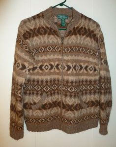 Up for bid is a Pre-Owned, gently used, Women's Lauren Ralph Lauren Exclusive Hand Knit Cardigan Sweater.  EXCELLENT CONDITION - no pulls, rips, stains, or holes.  The following are details of the sweater: Size Petite, PM - see measurements below 50% Llama & 50% Wool, made in China Full Zippered Front Closure Geometric Fair Isle pattern Brown & Beige colors 2 Front Pockets Chest measures approximately 19" (armpit to armpit - flat measurement) Length from top of shoulder to bottom of sweater meas Ivory Cardigan, Hand Knit Sweater, Sweater Patterns, Ralph Lauren Style, Zip Cardigan, Large Sweaters, Hand Knitted Sweaters, Fair Isle Sweater, Sweater Pattern