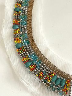 "Beaded Stone, Pave Chain Neckline Collar Applique, Bridal Applique,Stone Beaded, Silver Ball, Round Neckline Statement Boho Chic Bib, Make A Statement with this beautiful multi color bead work collar applique! Mesh Size 12\" W x 2 3/4\" L Bead Length: 1 3/8\" Long" Party Embellished Beaded Necklaces With Round Beads, Bohemian Beaded Necklaces For Summer Party, Bohemian Rhinestone Necklace For Festivals, Bohemian Embellished Necklaces For Party, Summer Bohemian Beaded Necklaces For Party, Bohemian Embellished Necklace For Party, Summer Party Bohemian Beaded Necklaces, Bohemian Beads For Summer Party, Bohemian Party Beads For Summer