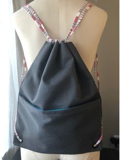 This functional drawstring bag is handmade and complete with a drawstring opening keeping belongings secure. Additionally, the front zipper provides a compartment for easy access making this the perfect bag for those on the go. Dog Walker, Reusable Grocery Bags, Perfect Bag, May 1, Grocery Bag, Drawstring Bag, Drawstring Backpack, Easy Access, Front Zipper