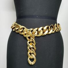 Marca:8888 China Queens
            
        Drag Queen accessories Looking to elevate your drag queen accessories game? Look no further than our Drag Queen Shop`s Versatile Belt Chain in a gorgeous gold color. Made from durable plastic, this waist chain is the perfect addition to any outfit, whether you`re on stage or off. With a width of 4cm and a length of 105cm, it`s the perfect size to make a statement without overpowering your look. Whether you`re looking to add a touch of glamour to a sim Trendy Gold Metal Body Jewelry, Gold Waist Chain For Parties, Party Gold Metal Waist Chain, Gold Metal Chain Belt For Parties, Gold Waist Chain With Chain Strap For Party, Trendy Chain Print Belt, Glamorous Gold Chain Necklace For Party, Gold Metal Waist Chain For Party, Trendy Gold Jewelry For Party