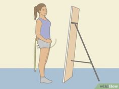 a woman standing in front of an easel