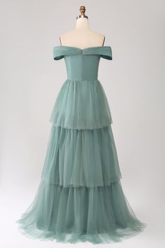 a dress on a mannequin with layers of tulle in the front and back