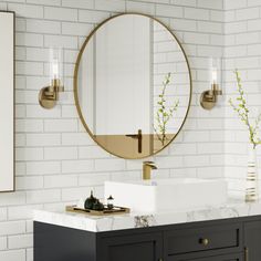 a bathroom with white brick walls and black vanity, round mirror on the wall above it