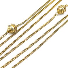 Yet another fashionable flapper find! At 24 inches in length this vintage gold tone necklace looks beautiful worn solo, double-wrapped or layered with one of our gemstone beaded necklaces. The triple layer necklace is made up of rope chain and decorative round accent beads. Heirloom fine jewelry that can be dressed up or down. Necklace is 24 inches in length, created with a goldtone base metal. The necklace has a snap lock clasp but can be easily slipped over head. The necklace is in optimal qua Triple Chain Necklace, Triple Layer Necklace, Flapper Necklace, Double Strand Necklace, Snap Lock, Gemstone Beaded Necklace, Layer Necklace, Vintage Monet, Double Chain