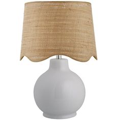 a white table lamp with a beige shade on the top and bottom part of it