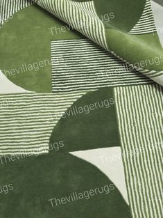 green and white area rugs with circular shapes on the top one has a striped design