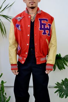 "Seventies \"DeLong Sportswear\" Red And Beige Letterman Jacket. Snaps Closure Up Front. Two Pockets. \"David Johnson\" Name Patch On Back. Sheep Face, Winged Shoe, \"EH\" And \"79\" Patches On Front. Small Shawl Collar. Ribbed Cuffs, Collar And Waist. Quilted Lining. Shell 80% Reprocessed Wool 15% Unknown Reprocessed Fibers 5% Other Fibers, Lining 100% Rayon, Interlining 50% Acrylic 50% Other Fibers Great/Good Vintage Condition - Pilling. Loose Threads. Marks On Sleeves. General Discolouration Red Collegiate Varsity Jacket For Winter, Sporty Red Varsity Jacket For Fall, Red Sporty Varsity Jacket For Fall, Collegiate Red Varsity Jacket With Long Sleeves, Red Collegiate Varsity Jacket For Fall, Collegiate Red Long Sleeve Varsity Jacket, Fitted Collegiate Varsity Jacket For Winter, Red Varsity Sports Outerwear, Red Varsity Jacket For Spring