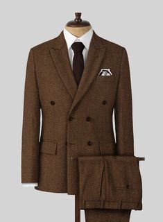 Revamp your look with our Highlander Coca Brown Tweed Suit, crafted to turn heads and boost your style cred! Crafted from pure wool, this suit wraps you in warmth with its thick twill texture, while the rich brown hue adds a unique twist to your fashion lineup. Whether you're dressing up for a winter gathering or a chic soirée, this suit is sure to add a bold, charismatic touch to your style, putting you at the forefront of the fashion scene. Why not add this fun, fashionable piece to your collection today?  Look Includes    Highlander Coca Brown Tweed Fabric    Double Breasted Jacket Style  Peak Lapel   Horn Brown  Buttons  Single Vent  Three Cuff Buttons  Two welted back pockets on trousers    Click 'Customize Now' to modify the look if needed.   Lining: Viscose; Dry Clean. Brown Tweed Suit, Tweed Suit, First Words, Brown Tweed, Linen Suits, Herringbone Tweed, Beautiful Suit, Tweed Suits, Dapper Men