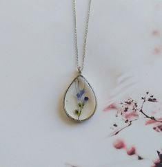 "Real flower necklace, woodland necklace, terrarium necklace, botanical necklace, real flower pendant, pressed flower necklace, resin finding These unique handcrafted necklaces are designed specifically for you! Made with natural flowers from the wild, this necklace is dainty, lightweight and it makes a perfect statement. Every VBRTN item is handmade with care in my Denver, CO studio. As someone that has passion for creating timeless healing pieces that you will fall in love with, I strive to tr Botanical Necklace, Real Flower Necklace, Petal Dust, Terrarium Necklace, Pressed Flower Necklace, Necklace Resin, Natural Flowers, Jewelry Card, Handcrafted Necklace