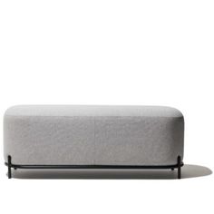 a gray couch with black legs and a white background