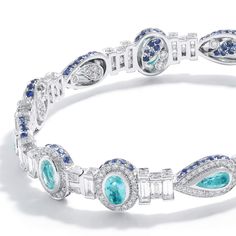 Trinity Collection Bracelet Set in 18K White Gold with Paraiba, Diamond, and Blue Sapphire. 5.69cts diamonds 3.50cts paraiba 0.99cts blue sapphire 18K white gold Luxury Blue Oval Diamond Bracelet, Luxury Blue Gemstone Diamond Bracelet, Luxury Blue Tennis Bracelet, Tiffany Gold Bracelet, Tiffany Bracelet Gold, Tiffany Bracelets, Antique Bracelets, Paraiba Tourmaline, Diamond Bangles Bracelet