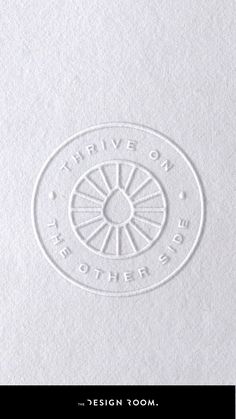 a white paper with the words design room on it and an image of a circle in the center