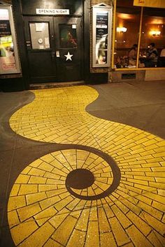 the walkway is painted yellow and has an interesting design