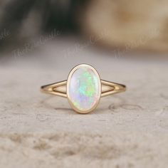 Unique Opal Engagement Ring Solid Gold Rings Art Deco Bezel Set Ring Vintage Oval cut Rainbow Opal Ring Minimalist Wedding Rings For Women ITEM DETAILS ●Available in yellow, white or rose solid 10k, 14k or 18k gold. This ring can be made in Platinum. ❀❀Center Stone: Natural Opal Shape: Oval shape Size: 6x9mm Band width around 1.5mm Visit my shop for more jewelry: https://www.etsy.com/shop/TheRoseCastle if you would like to customize your unique ring, you may contact us about your ideas and pictures. Hope I could get the chance to create fabulous rings for you! ❀Production ---- This ring is handmade and very good quality! Please allow 2-4 weeks for production. It can be made to any ring size.  ❀Engraving service We accept the engraving order, leave a note when placing an order or contact us Opal Bezel Ring, Bezel Opal Ring, Opal Gold Necklace, Classic Oval Bezel Set Opal Ring, Classic Oval Opal Ring With Bezel Setting, Modern Opal Ring With Bezel Setting, Oval Opal Rings With Bezel Setting, Oval Opal Jewelry With Bezel Setting, Classic Opal Promise Ring With Bezel Setting