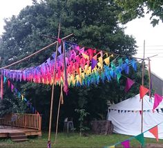 colorful streamers hanging from the side of a tent