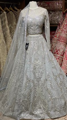 Cloudy grey intricate with fully sequence, studs motifs thread embroidery and crystal stone work lehenga embellished with pearl design paired with high neck blouse and net dupatta. Fabric: Net Size:38 Ready to Ship! Indian Lehangas, Stone Work Lehenga, Eid Fits, Walima Dresses, Party Wears, Desi Fits, Indian Bridesmaid Dresses, Cultural Fashion, Walima Dress