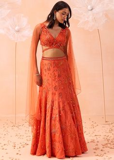 Fish cut lehenga with all over flora and fauna motifs paired with v neck embroidered blouse and dupatta. V Neck Crop Top Lehenga, Orange Indian Outfit, Fish Cut Lehenga, Mummy Outfit, Indian Fits, Fish Cut, Candy Orange, Orange Lehenga, Latest Bridal Blouse Designs