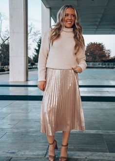 Step out in style this holiday season in our Make Me Blush Midi Skirt! This foil-coated midi skirt brings a touch of glam to your wardrobe and can be dressed up or down to suit your mood. Make a statement with a graphic tee, or look chic at the office with a sweater! Jenna is 5'2" wearing a size XS Make Me Blush, Look Chic, Suits You, In Style, Graphic Tee, Midi Skirt, Holiday Season, Foil, Blush