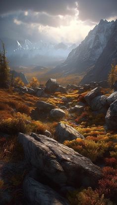 the sun shines through the clouds over some rocks and grass in front of mountains