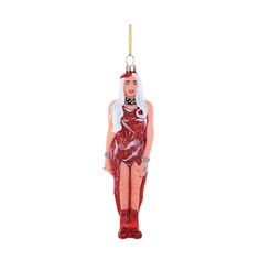 a glass ornament with a woman in red dress and boots on it's head