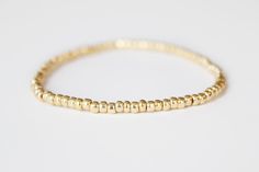 Gold Beaded Bracelet - Neeva by junghwa on Etsy https://www.etsy.com/listing/185039880/gold-beaded-bracelet-neeva Adjustable Gold Stretch Bracelet For Everyday, Everyday Gold Beaded Stretch Bracelet, Classic Gold Beaded Stretch Bracelet, Adjustable Gold Beads Stretch Bracelet For Everyday Wear, Dainty Yellow Gold Stretch Bracelet For Everyday, Gold Beaded Minimalist Stretch Bracelet, Minimalist Gold Beaded Stretch Bracelet, Gold Minimalist Stretch Bracelet For Everyday, Minimalist Gold Stretch Bracelet For Everyday