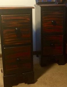 two black and brown chests with pictures on them