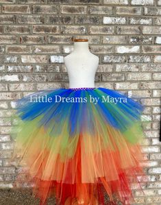 Welcome to Little Dreams by Mayra Tutus are fun and easy to match with any accessory so I am offering this tutu, its available in any color, any size! *If you need a color combination just send me a message at checkout you will select the longer Lenght of the tutu from waist to floor, this length will be in the back and will go shorter from there, you can provide me your information or you can follow my chart COLOR you can choose any combination, last pic has my chart tutu skirt in main pics has Multicolor Tulle Skirt For Summer, Playful Multicolor Tulle Tutu Dress, Multicolor Playful Tulle Tutu Dress, Playful Rainbow Tutu Dress For Spring, Carnival Tulle Tutu Dress, Whimsical Rainbow Tulle Tutu Dress, Princess Tulle Tutu Dress For Carnival, Princess Style Tulle Tutu Dress For Carnival, Multicolor Tulle Tutu Dress For Costume Party