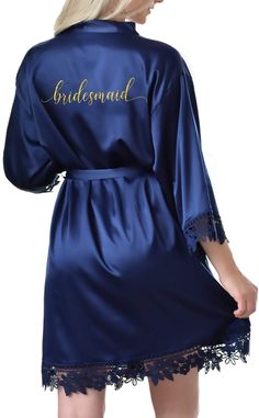 the bridesmaid robe is blue with gold lettering on it and lace trims