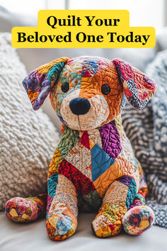 a colorful stuffed dog sitting on top of a bed with the words quilt your beloved one today