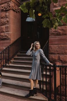 Experience comfort and style with our stunning Beau Dress in Gray. The soft knit fabric and nonfunctional bow style collar add a playful touch to this maternity-friendly women's dress. With a pleated midi-length skirt and hidden back zipper, you'll stay stylish and put-together all day long. Who says fashion can't be functional?! mommy & me, cozy layering outfits, street style fashion, fall neutrals, city chic fall outfits, autumn workwear, warm tones, cozy coffee shop looks Layering Outfits Street Style, Autumn Workwear, Cozy Coffee Shop, Fall Neutrals, Bow Style, Cozy Coffee, Chic Fall Outfits, Fall Photoshoot, Layering Outfits