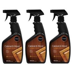 three bottles of wood cleaner on a white background