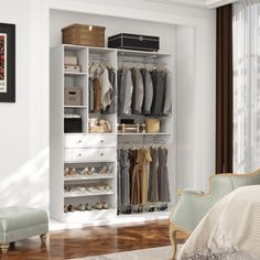 a bedroom with a bed, chair and closet full of clothes on it's shelves