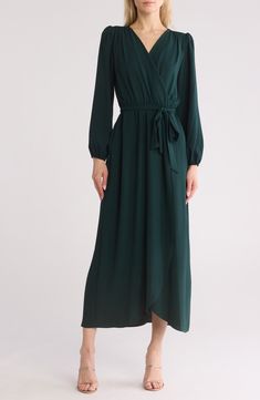 A faux-wrap maxi dress offers flattering style with gently puffed sleeves and a tie waist. 56" length Surplice V-neck Long sleeves Slips on over head Elastic waist with tie sash High-low hem Unlined 100% polyester Machine wash, tumble dry Imported Model stats: 5'10" height, 32" bust, 25" waist, 36" hip. Model is wearing size 4. Satin Long Sleeve, Blouson Dress, Daytime Dresses, Dress Satin, Dress Crafts, Long Sleeve Maxi, Maxi Wrap Dress, Work Wardrobe, Sheath Dress