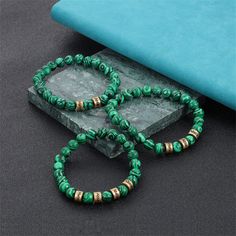 ◉ This custom malachite bracelet is a unique and meaningful piece of jewelry that can be personalized with up to 2-4 names. The bracelet is made with high quality turquoise beads. ◉ Each bead is carefully selected and strung together to create a stunning bracelet that symbolizes drive out evil and protection. The bracelet is complemented with a durable ID name bangle, which can be engraved with the names you provide, adding a personal touch to the piece. ◉ Measuring to fit most wrist sizes comfortably, this bracelet is perfect for men, husbands, or fathers. It's a thoughtful and stylish gift for various occasions, including Father's Day, birthdays, anniversaries, or any special moment you want to celebrate. ◉ The malachite stone not only adds an aesthetic appeal to the bracelet but is also Green Malachite Beaded Bracelets, Green Malachite Beaded Bracelet As Gift, Green Malachite Beaded Bracelets As Gift, Green Malachite Bracelets For Gifts, Green Malachite Spiritual Beaded Bracelets, Spiritual Green Malachite Beaded Bracelets, Malachite Jewelry With 8mm Round Beads, Green Malachite Round Bracelets, Malachite Beaded Bracelets As Gift