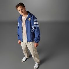 Look like a track star no matter where you are in the adidas Argentina Bringback Track Men's Jacket. It has that old-school appeal modernized to bring that classic style right into the 2020s. And if you genuinely are a track star, it's easy to remove with its zip-up design, so you're ready whenever it's time to submerge yourself into the sport. Features the adidas logo. Zip-up design. Displays a striped design the brand is known for. Color: muted purple. Adidas Three Stripes Outerwear For Sports Events, Adidas Outerwear With Three Stripes For Sports Events, Casual Windbreaker For College Sports Season, Adidas Athleisure Track Jacket With Side Stripes, Casual Track Jacket For Fall Sports Events, Casual Fall Track Jacket For Sports Events, Casual Adidas Outerwear With Three Stripes, Adidas Sporty Streetwear Track Jacket, Adidas Sporty Windbreaker With Three Stripes