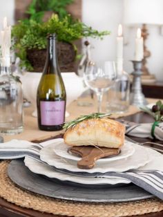 the table is set with wine and bread