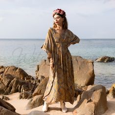 Make a stylish statement in this breezy silk blend kaftan! With its vibrant print and flowy silhouette, this kaftan is perfect for making memories - Retro-inspired print turns up the fun - Relaxed, oversized fit flatters all figures - Breezy silky blend fabrication keeps you cool - Deep V-neckline and ruched details Show off your bold sense of style in this eye-catching kaftan. This billowy silhouette and lively print keep you comfortable and chic from beach to dinner date. Pair it with wedge or sandals for an effortlessly glam look. Made from lightweight, breezy silky blend, this kaftan flatters all figures. The vibrant print and flowy shape make it perfect for tropical getaways, summer barbecues, and relaxed weekend. A chic way to make statement Yellow V-neck Beachwear Maxi Dress, Festival Dress With Floral Print And Kimono Sleeves, Mustard Maxi Beach Dress, Yellow V-neck Kimono For Vacation, Mustard Maxi Dress For Beach, Yellow Flowy Beachwear Dress, Yellow Maxi Boho Dress For Summer, Yellow Boho Print Beach Dress, Flowy Yellow Summer Kaftan