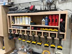 a workbench with tools and other items on the shelf in front of it