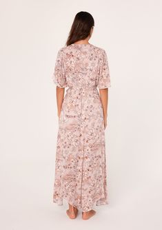 A flowy short flutter sleeve maxi dress in a pink floral print. Floral print Relaxed fit Short flutter sleeves Maxi length Asymmetric hemline V-neckline Elastic waist Self-tie waist belt Lined Bohemian maxi dress Feminine florals add a pretty touch to this classic boho maxi dress. With short flutter sleeves, a flattering v-neckline, and a waist-defining tie belt. The unique asymmetric hemline adds a sweeping touch to the long flowy skirt. Model is 5'9, wearing a size S.Style: I-73347WL-SKF-CG Flowy Belted V-neck Maxi Dress, Flowy V-neck Belted Maxi Dress, Flowy Belted Maxi Dress With V-neck, Spring Short Sleeve Belted Maxi Dress, Belted Short Sleeve Maxi Dress For Spring, Casual Flowy Belted Maxi Dress, Flowy Floral Maxi Dress With Surplice Neckline, Vacation Belted Short Sleeve Maxi Dress, Vacation Short Sleeve Belted Maxi Dress