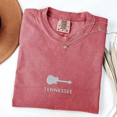 Tennessee Tee with Embroidered Guitar Design - Nashville Country Music Shirt Show off your Tennessee pride with this unique embroidered guitar shirt, perfect for lovers of country music and the Nashville vibe. This Tennessee tee captures the spirit of the state with a vintage style that makes it a must-have for any TN shirt collection. Whether you're hitting the honky-tonks on Broadway or rocking out at a backyard BBQ, this Nashville shirt is an ideal Nashville gift that celebrates Tennessee's r Nashville Vibes, Nashville Country Music, Embroidered Guitar, Nashville Country, Guitar Shirt, Country Music Shirt, Country Music Shirts, Music Tees, Cow Girl