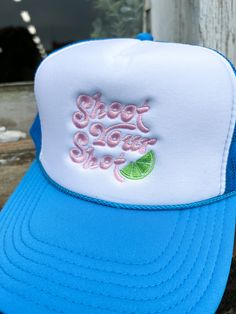 a blue and white trucker hat with the words slow down on it's front