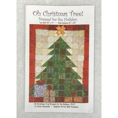 an old christmas tree quilt pattern is featured in the front cover of a book,